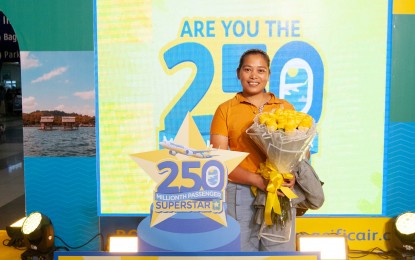 <p><strong>LUCKY PASSENGER.</strong> Russel Capaniarihan, an overseas Filipino worker in Singapore, flies home on Dec. 11, 2024. As Cebu Pacific's 250 millionth passenger, she received PHP250,000 and 25 free round trip flights to any of CEB's domestic and international routes upon her arrival at the Ninoy Aquino International Airport. <em>(Photo courtesy of CEB)</em></p>