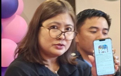 <p><strong>CHECK THE APP.</strong> Department of Tourism-Cordillera Regional Director Jovita Ganongan shows an online application where tourists can check DOT-accredited facilities which are compliant with the industry standards in this Feb. 19, 2025 photo. She said responsible tourism includes being wary of scams and becoming victims of any criminal minds<em>. (PNA photo by Liza T. Agoot)</em></p>